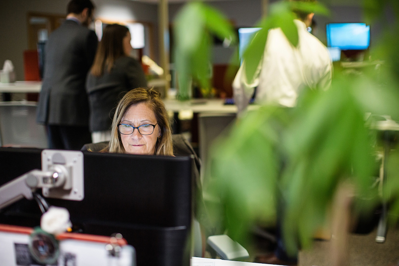 Employee working with plant not in focused